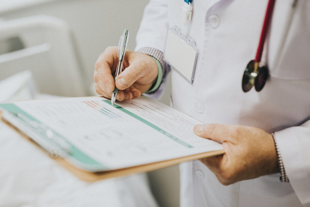 physician-noting-down-symptoms-patient (1).jpg
