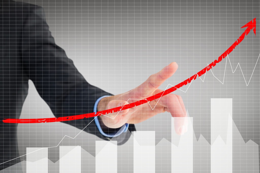 businessman-showing-business-evolution-with-graphic.jpg